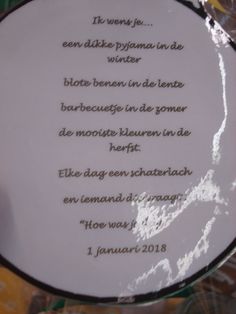 a close up of a plate with writing on the front and back side in french