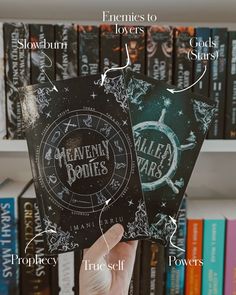 someone holding up two harry potter bookmarks in front of bookshelves with instructions