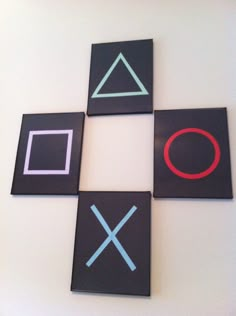 four black and white squares with different colored shapes on the top one has an x symbol