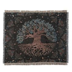 the tree of life tapestry is hanging on a wall