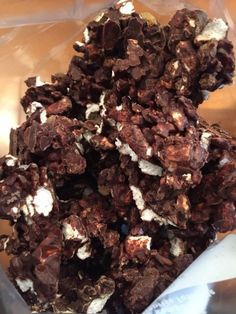 a pile of chocolate and marshmallows sitting on top of a plastic bag