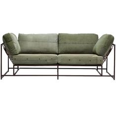 a green couch sitting on top of a metal frame