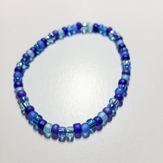 Get ready to add a pop of sweet style with our Blueberry Stretch Bracelet! This stretchy bracelet features delightful small beads in various shades of blue, resembling a tasty blueberry. Easily dress up any outfit with this fun and playful accessory. Blue Bracelet Ideas, Small Beads, Stretchy Bracelets, Sweet Style, Blue Bracelet, Stretch Bracelet, Stretch Bracelets, Shades Of Blue, Art Inspo