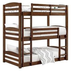 a bunk bed with two sets of mattresses on top and bottom bunkbeds