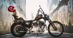 a motorcycle parked in front of a brick wall