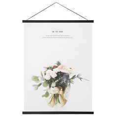 a poster hanging on the wall with flowers