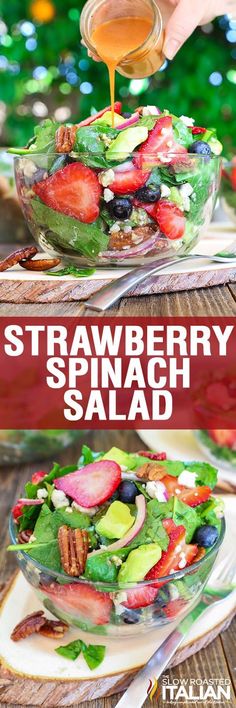 strawberry spinach salad in a glass bowl being drizzled with dressing