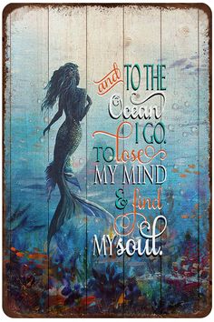 a wooden sign that says and to the ocean i go to lose my mind and find my soul