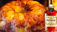 a pineapple bundt cake next to a bottle of hennessy's apple cider