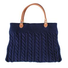 a blue knitted bag with leather handles