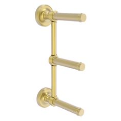 an image of two handles on a wall mounted shower faucet in polished brass