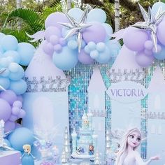 a frozen princess birthday party with balloons and decorations