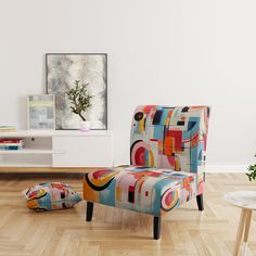 a brightly colored chair and ottoman in a white room with wood flooring on the parquet