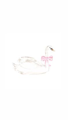 a white swan with a pink bow on its neck