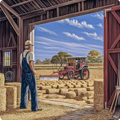 a man standing in front of a barn door with a tractor and hay bales