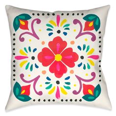 a white pillow with colorful flowers on it