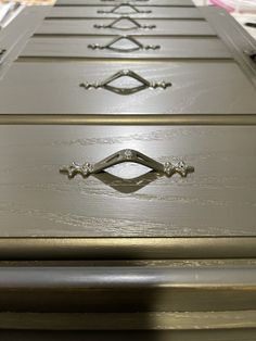 the drawers are painted gray with gold trim