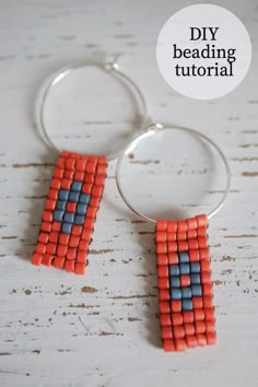 an orange and blue beaded hoop earrings on a white wooden table with the words diy beading tutorial written above it