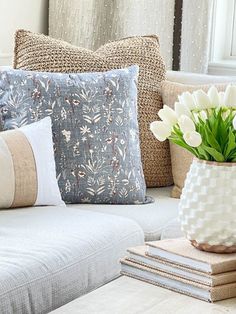 a couch with pillows and flowers in a vase next to the words, why every home decor should know about clean & dirty colors