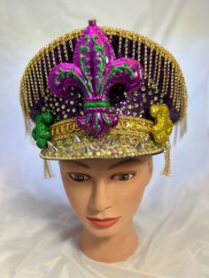 Congratulations! You have been promoted to Captain of Mardi Gras 🎭🎉 With this promotion comes great responsibility. You are required to laissez le bon temps rouler at every moment when wearing this one of a kind, handmade headpiece. Impress everyone on bourbon street this Mardi Gras with your own personal carnival sparkle! Adjustable Headpiece For Carnival Festival, Adjustable Headpieces For Carnival Festival, Adjustable Teardrop Crown Costume Hat For Parties, Mardi Gras Adjustable Costume Hat With Round Crown, Adjustable Mardi Gras Costume Hat With Round Crown, Adjustable Round Crown Costume Hat For Mardi Gras, Adjustable High Crown Headpieces For Carnival, Adjustable Structured Crown Headpiece For Carnival, Adjustable Costume Hats For Mardi Gras Carnival