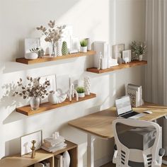 there are three shelves with plants and pictures on them, along with a laptop computer