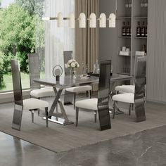 a dining room table with white chairs and an open bookcase on the wall behind it