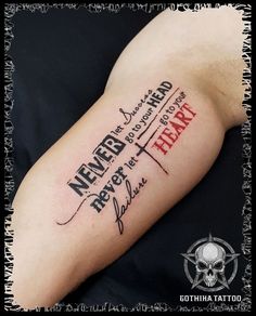 a man with a tattoo on his arm that says never heard, he's not afraid