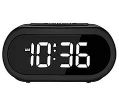 the alarm clock is black and has white numbers