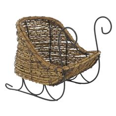 a small chair made out of wicker and iron