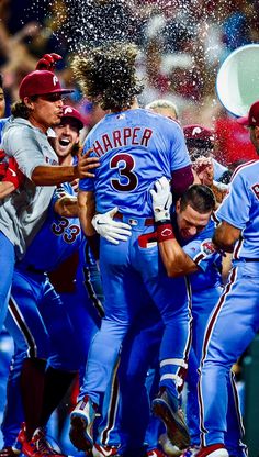 the baseball players are celebrating their team's victory