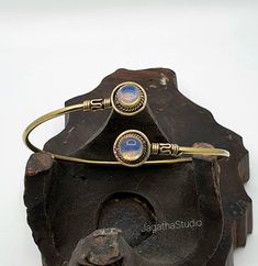 HANDMADE  Beautiful Boho, hippie handcrafted arm cuff bracelet with detailed and Beautiful gemstones  This piece has some beautiful work  Handmade with high quality hypoallergenic Jewelery brass, nickel free. Adjustable, it will fit any size. Aprox diameter round gemstone piece: 1.3 cm LINK Don't miss the rest of the collection, please follow the link.  https://www.etsy.com/uk/shop/JagathaStudio Nickel Free Bohemian Bracelets, Nickel-free Bohemian Bracelets, Bohemian Brass Bracelet Jewelry, Bohemian Brass Bracelet, Adjustable Brass Beaded Bracelets, Handmade Adjustable Spiritual Bangle, Handmade Adjustable Artisan Bangle, Unique Adjustable Hand Wrapped Bangle, Adjustable Bohemian Brass Bracelets