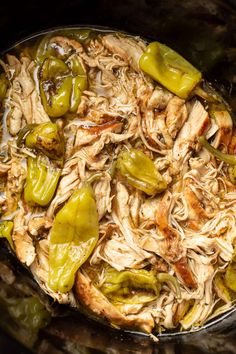 chicken and peppers are cooking in the slow cooker