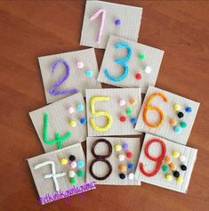 the numbers are made out of fabric and have different colored dots on them, including one for each number