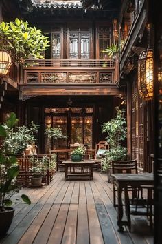 the inside of an old building with wooden floors and plants in potted planters