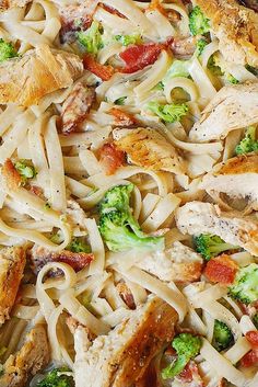 a pizza with chicken, broccoli and pasta on it