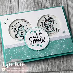 a card with two snowmen on it and the words let it snow written in black ink