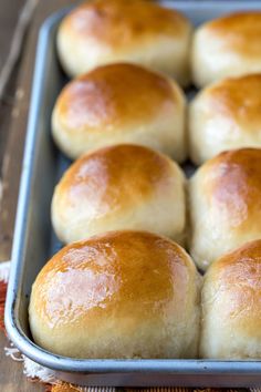 freshly baked bread rolls in a baking pan