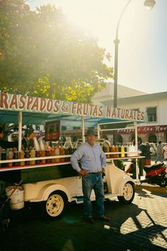 a man standing in front of a food truck