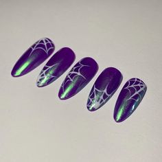 Purple with green shimmer spider web press ons ! Perfect for this upcoming spooky season reusable, custom, handmade press on nails Get your salon quality nails at home with Blingedbyjaz Press On Nails All sets are made with GEL nail polish. These nails are reusable, if you take it off right. Each set comes with 10 handmade press on nails, a mini file, a mini buffer, a cuticle stick, glue and 2 alcohol pads. Please make sure you follow the sizing kit and select your size (XS, S, M, L,) or write d Samhain Nails, Purple And Green Halloween Nails, Nails Purple And Green, Green Purple Nails, Spiderweb Nails, Nails Application, Fake Nails Designs