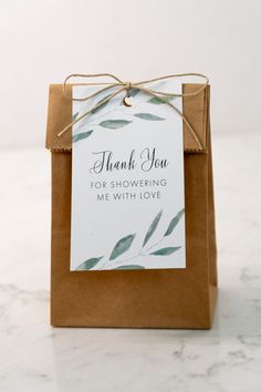 a brown bag with a thank you tag attached to it