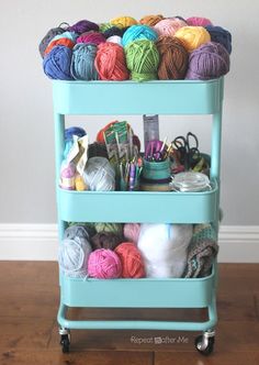 a cart filled with yarn and crochet supplies