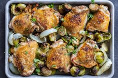 chicken, brussel sprouts and onions in a casserole dish