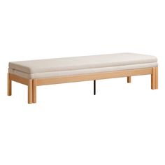 a wooden bench sitting on top of a white floor