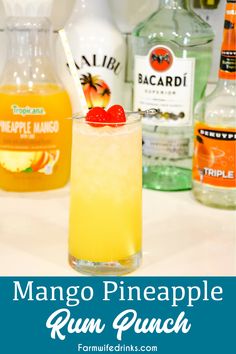 the mango pineapple run punch is garnished with a cherry