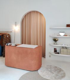 a living room filled with furniture and shelves