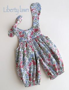 a baby's dress made from liberty lawn fabric