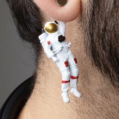 Introducing our Hand-Painted 3D Printed Astronaut Earrings: Size: Length: 1.8 in; Width: .5 in Weight: 3 grams for each earring. 100% Handmade with attention to detail Hypoallergenic Stud made of Surgical Steel Unique 3D Printed design Each pair is hand-painted to order Slight variations may occur due to handmade nature Embark on a cosmic journey with our extraordinary 3D-printed astronaut earrings. Explore our stellar collection of exquisite designs that showcase the wonders of space. Elevate y Stocking Filler Earrings Geek, Astronaut Earrings, Starter Earrings, Space Earrings, Cool Science, Funky Gifts, Rocket Launch, Astronaut Space, Whimsical Jewelry