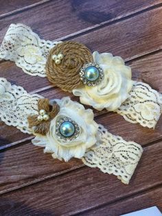 two garters with lace and pearls on them