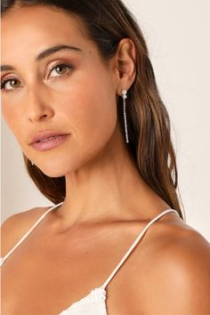 Be ready for any occasion that calls for effortless elegance with the Lulus Trendy Radiance Silver Rhinestone Pearl Drop Earrings! These stunning, drop-style earrings feature slender silver-toned chains adorned with dazzling clear rhinestones that fall from posts with shiny faux pearl accents. Post backs. 2. 5'' long. 80% Glass, 20% Plastic. Imported. Lulus | Trendy Radiance Silver Rhinestone Pearl Drop Earrings. Winter Soiree, Lulu Fashion, Silver Drop Earrings, Silver Rhinestone, Pearl Drop Earrings, Clear Rhinestones, Pearl Drop, Faux Pearl, Bridal Jewelry