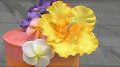 a close up of a cake with flowers on it